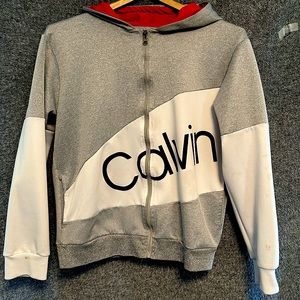 Calvin Klein zip up hoodie. Size Small. Light gray, white and red.